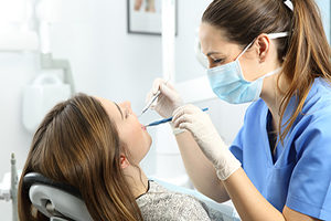 Dentist treating the patient