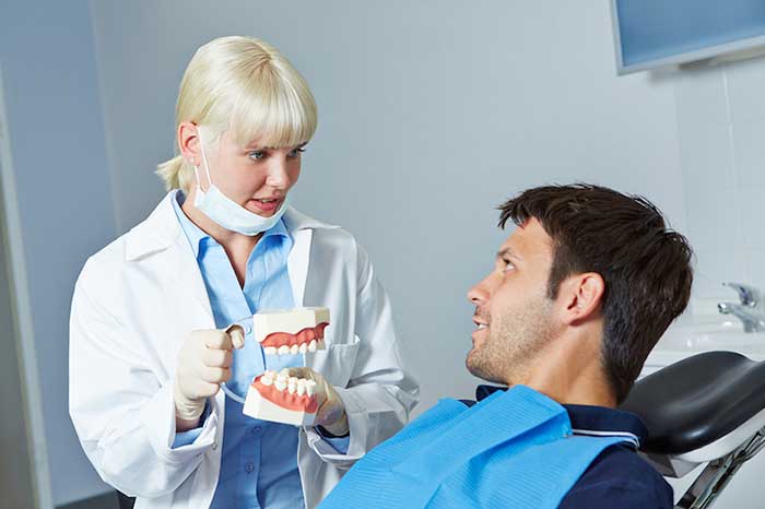 Dentist treating the patient