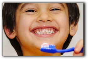 Small boy brushing his teeth