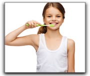 A small girl brushing her teeth