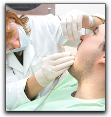 Dentist treating the patient