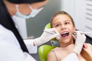 Dentist treating small boy